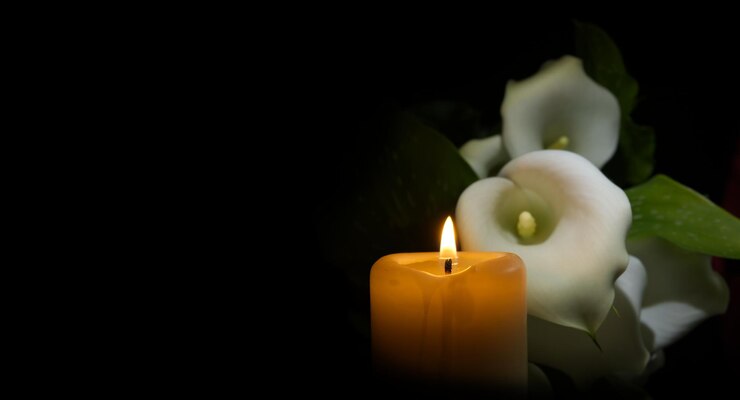 white-calla-lily-flowers-burning-wax-candle-darkness